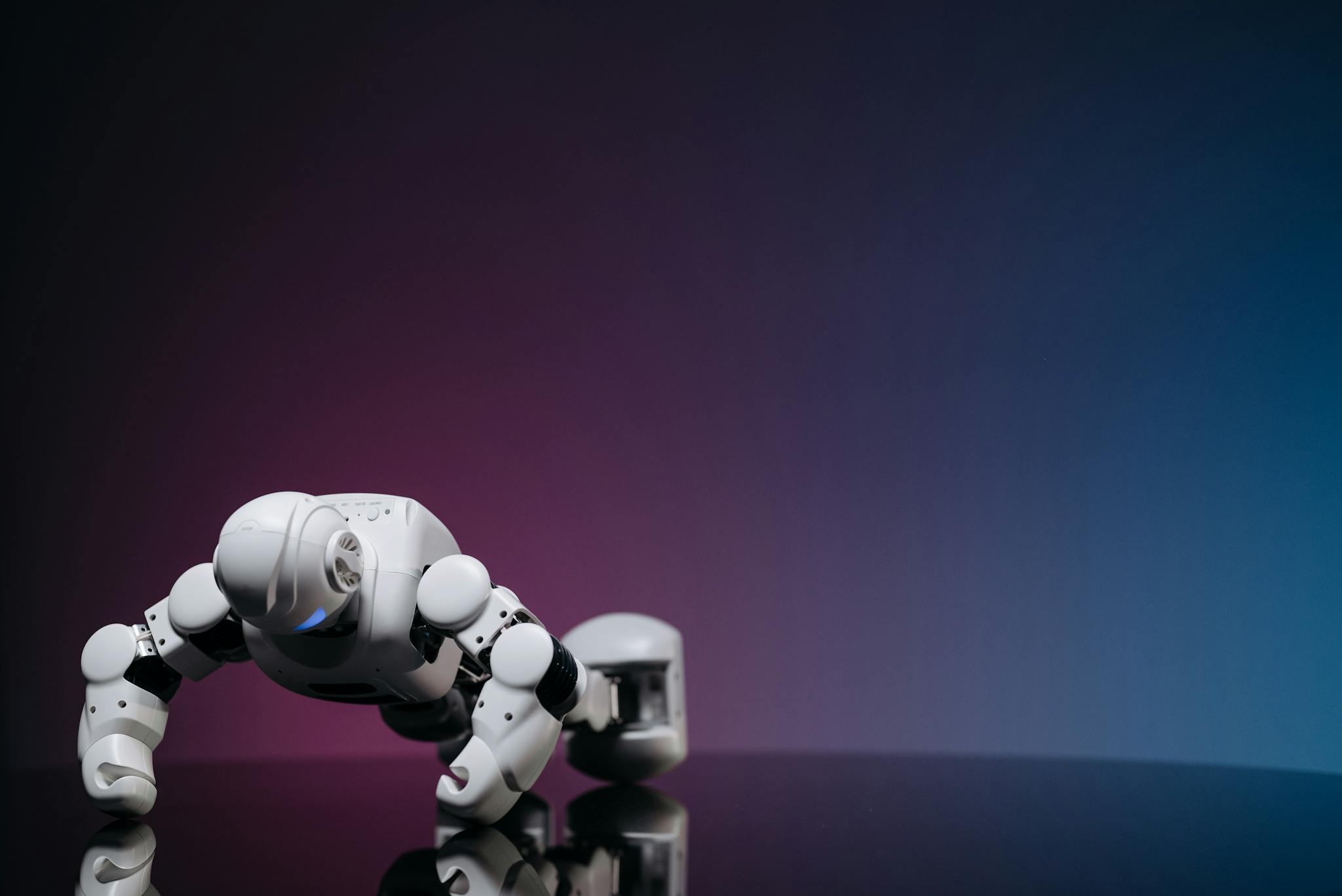 White robot doing push-ups on reflective surface, futuristic concept.